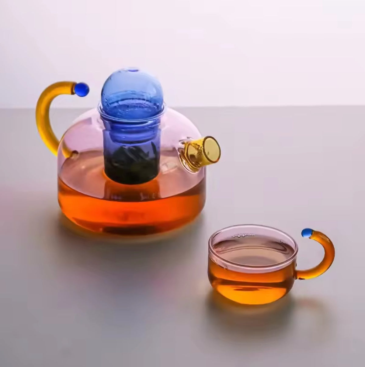 Contrasting Color Heat Resistant Glass Teapot and CupstevanaaContrasting Color Heat Resistant Glass Teapot and Cups